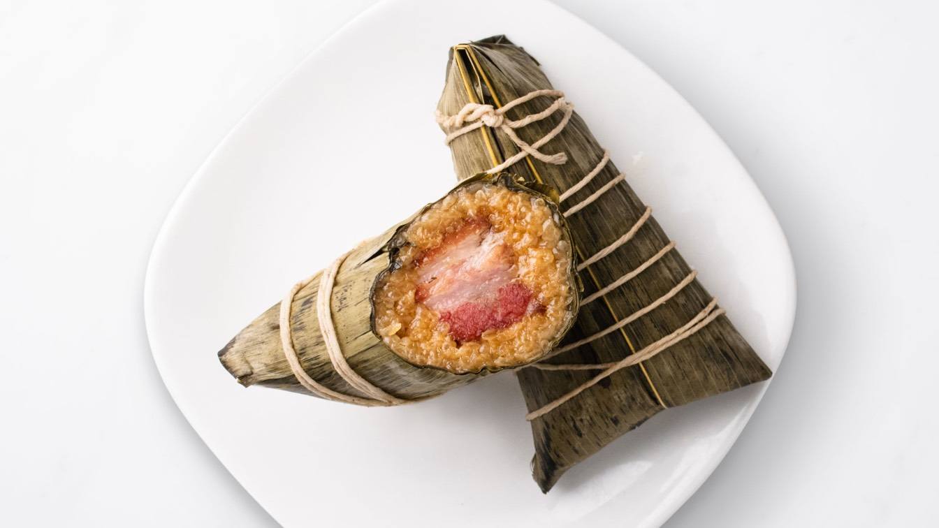 Kurobuta Pork Sticky Rice Wraps laid on a white plate