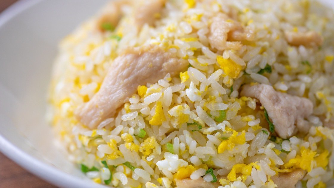 Jidori Chicken Fried Rice on a white plate, close up