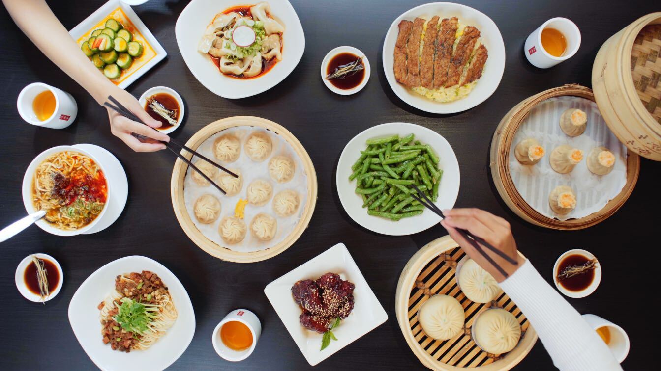 Overhead photo of table top full of Din Tai Fung dishes