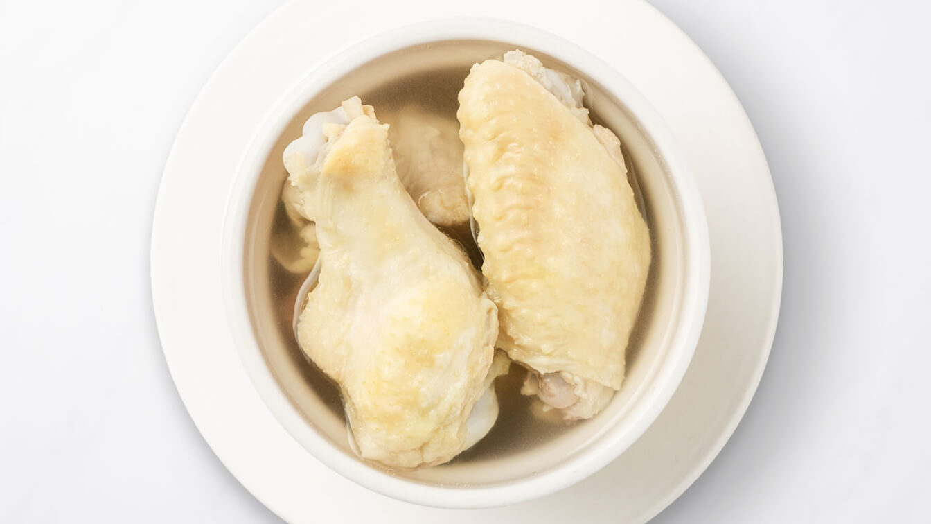 House Jidori Chicken Soup (Steamed) in a white bowl