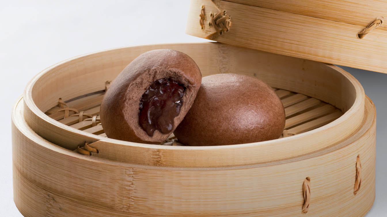 Chocolate buns in a bamboo basket. 