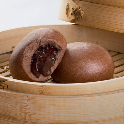 Chocolate buns in a bamboo basket. 