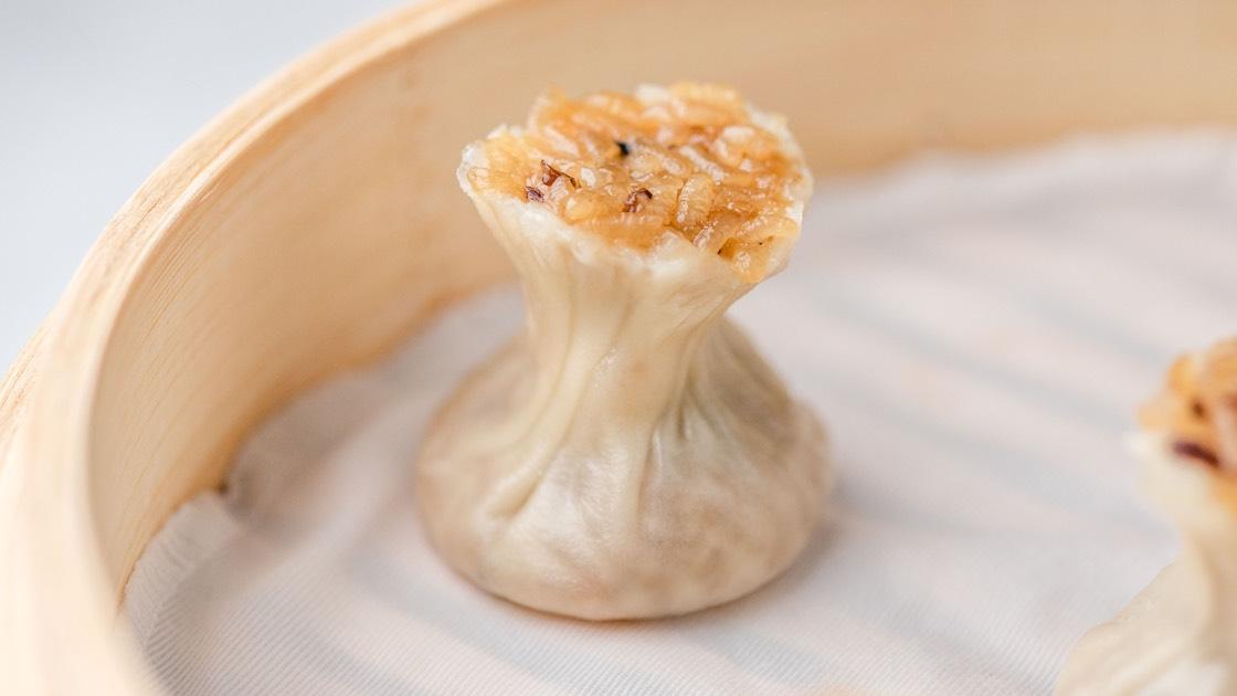 Sticky Rice & Kurobuta Pork Shao Mai in a steamer basket, close up