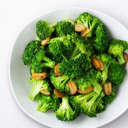 Sauteed Broccoli with Garlic in a white bowl
