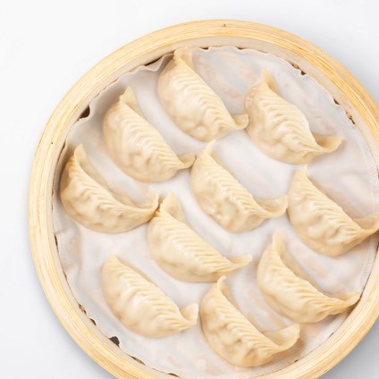 Jidori Chicken Dumplings in a steamer basket