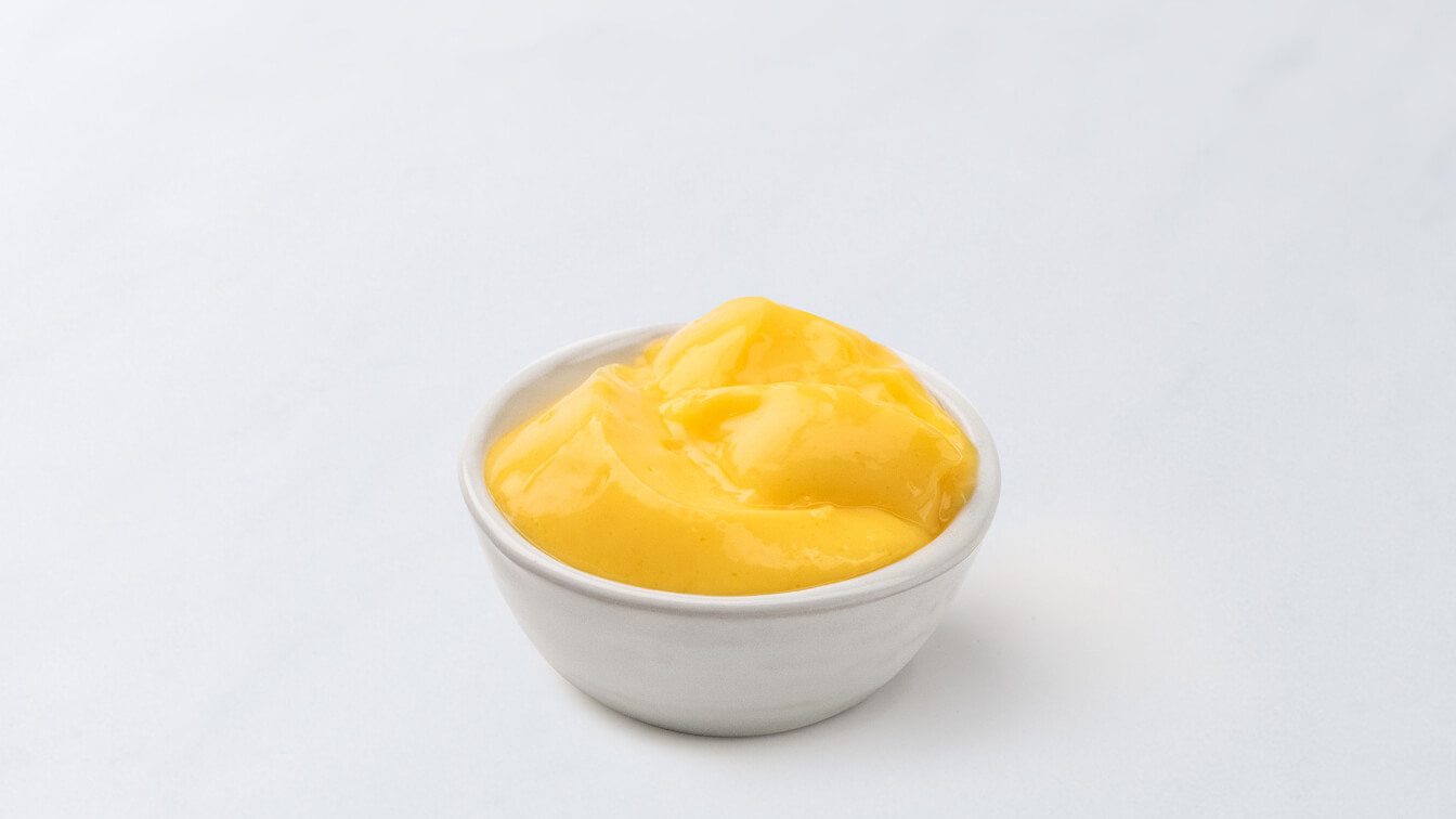 White bowl filled with vanilla pudding